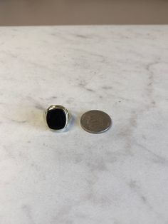 A Rare Beautiful and Classic 10kt Yellow Gold Unisex Onyx Ring consisting of a 12mm x 14mm Antique Cushion Shape Genuine Onyx Gemstone flat buff top bezel set in old style ring in finger size 4 1/4. This ring can be adjusted to any size. Excellent Condition. This item would Retail for $749.00 Antique Cushion, Estate Ring, Estate Rings, Onyx Gemstone, Old Style, Onyx Ring, Gold Hoop, Mens Wedding Bands, Gold Hoop Earrings