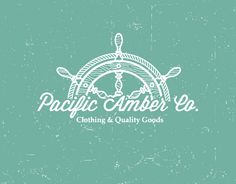 the logo for pacific amber & co clothing and quality goods, with an image of a steering wheel