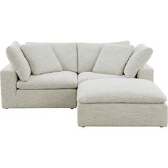 a white couch with pillows and a footstool in front of a white background