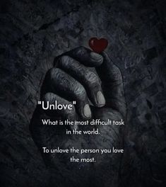 a hand holding a red heart with the words unlov written on it in black and white