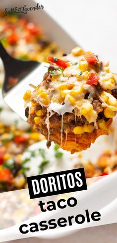 a spoon full of taco casserole being lifted from a white dish with the words doritos taco casserole on it