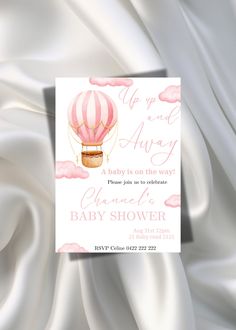 a baby shower card with a hot air balloon in the sky