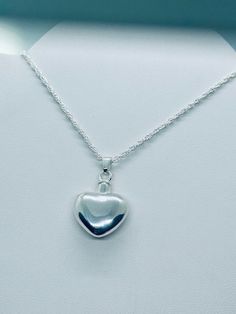 This beautiful heart pendant is a unique way to hold a loved one close. This pendant can hold a small amount of cremains, lock of hair, or dirt from the sacred burial grounds. This piece comes on an 18" matching chain. GOOD TO KNOW: ♥ Available in 14k plated gold or a Sterling Silver ♥THIS PENDANT CAN BE ENGRAVED-SEE PERSONALIZATION SECTION ♥Fill kit included with pendant CARE: ♥Both 14k plated gold and Sterling Silver are resistant to rust, corrosion, and tarnishing, but we still recommend for Cremation Jewelry Necklaces, Ashes Jewelry Cremation, Memorial Jewelry Ashes, Cremation Necklaces, Ashes Necklace, Ashes Jewelry, Urn Necklaces, Memorial Necklace, Small Jewelry Box