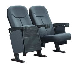 two gray seats sitting next to each other in front of a white background with no people