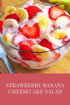 strawberry banana cheesecake salad in a glass bowl on top of a wooden cutting board