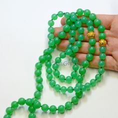 "DESCRIPTION: Thank you for coming in! Breath-taking imperial chrysoprase bead necklace with rare sphere stones and 18k solid gold granulation spacers, 423 carats of mesmerizing glowing green material! Extremely rare and precious! 36\" long Lariate necklace! You'll get the necklace you see! SIZE: 8mm-9.2mm MATERIAL: 18k solid gold, Imperial Chrysoprase(Australian Origin)" Elegant 8mm Round Beads For Gems And Cabochons, Green Onyx Round Beads Jewelry, Chrysoprase Gemstone Jewelry With Round Beads, Elegant 8mm Round Beads For Jewelry Making, Jade Emerald Necklace With Round Beads For Healing, Green Hand-strung Long Necklace, Green Onyx Gemstone Bead Round Necklaces, Green Onyx Round Gemstone Bead Necklace, Green Onyx Gemstone Beads Necklace