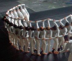 a group of people standing on top of each other