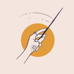 a hand holding a pencil in front of an orange sun