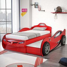 a child's bedroom with a red car bed