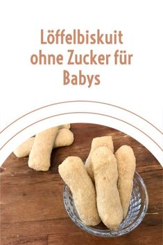 an advertisement for some kind of food on a wooden table with the words,'offleibskut ohne zucker fur babys '