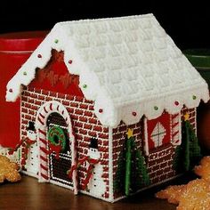 a gingerbread house decorated with icing and decorations