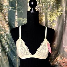 Pale Yellow Bralette Size M/L Sexy Lacy Design Brand New With Tags Lace Triangle Bralette. Floral Sheer Lace Triangle Low-Cut Unpadded Mesh Lined Bralette, Adjustable Straps, And Back Hook Closure. 95% Nylon 5% Spandex Spring Party Bra With Delicate Lace, Sheer Bra For Party In Spring, Sheer Party Bra For Spring, Spring Sheer Fitted Bra, Fitted Low-cut Bra For Spring, Fitted Sheer Triangle Top Bra, Sheer Triangle Top Fitted Bra, Spring Delicate Lace Fitted Bra, Fitted Triangle Top Bra With Delicate Lace