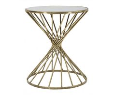 the side table is gold and has a glass top with an intricate design on it