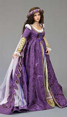 a doll in a purple dress with gold trim