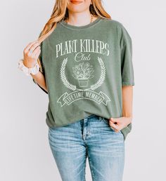 This funny social club-style plant killer shirt is the perfect gift for anyone who always manages to kill their plants. Celebrate their unique gardening skills with this humorous and stylish tee, designed to bring a smile to any plant lover's face. 🌱 Funny Plant Killer Design: Features a humorous social club-style print that proudly proclaims their plant-killing prowess. 👕 High-Quality Material: Made from soft, comfortable fabric that feels great against the skin. 😂 Gardening Humor: Perfect f Crew Neck Cotton T-shirt With Plant Details, Cotton Crew Neck T-shirt With Plant Details, Cotton Crew Neck T-shirt With Plants, Cotton T-shirt With Plant Detail, Short Sleeve, Crew Neck Cotton Shirt For Gardening, Gardening Humor, Face Funny, Gardening Gift, Garden Birthday