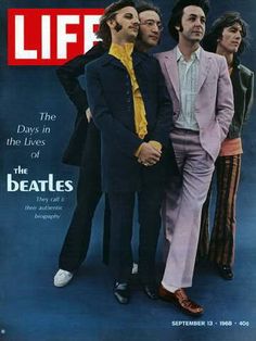 a magazine cover with three men in suits