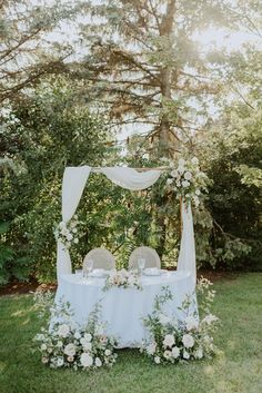 an outdoor table set up for a wedding