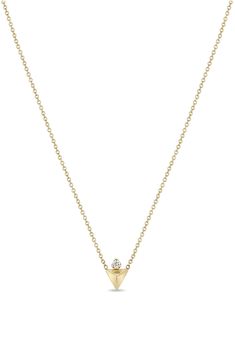 A dainty diamond rises over the glossy pyramid pendant anchoring this delicate 14-karat-gold chain necklace. 14" length; 2" extender; 1/4" square pendant Total diamond weight: 0.03ct. Color: F–G Clarity: SI2 14k gold/diamond Made in the USA >Diamond Guide 14k Yellow Gold Charm Necklace With Diamond, Minimalist Yellow Gold Charm Necklaces With Diamond Accents, 14k Yellow Gold Charm Necklace With Single Diamond, Dainty 14k Gold Diamond Necklace, Tarnish Resistant, Gold Diamond Triangle Jewelry, 14k Gold Diamond-shaped Necklace For Gift, Elegant Gold Triangle Necklace, 14k Gold Diamond-cut Cross Pendant, Zoe Chicco