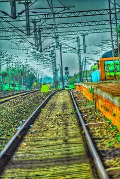 the train tracks are empty and there is no one on them or people in the background