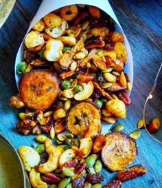 a bowl filled with food on top of a wooden table