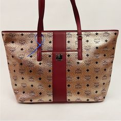 New Mcm Visetos Anya Champagne Tote Bag Msrp $780 Never Used 12”H X 18.5”W X 5.5”D Handle Drop 9.5” Zip Top Closure With Pockets Inside Mcm Bag, Mcm Bags, Zip Top, Womens Tote Bags, Inside Pocket, Champagne, Tote Bag, Red