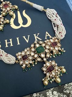 One of our favorite picks for the wedding season ♥️ The gorgeous choker is beautifully handcrafted by our skilled Indian craftsmen in Kundan stones, beads, mini pearls, and gold plated. The beautiful Kundan earrings add to the traditional ethnicity of the piece. Material: Brass, Copper, Silver with gold plating Kundan, Carved stones, Pearls. Length of earrings: 5.8 cms Fusion Style Choker For Wedding And Festivals, Fusion Style Wedding Choker For Festivals, Multicolor Gold Beaded Jewelry For Wedding, Bridal Choker Set, Elephant Bangle, Kundan Jewellery Bridal, Indian Choker, Stone Necklace Set, Wedding Necklace Set