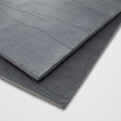 two pieces of slate sitting on top of each other