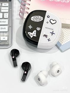 an assortment of earbuds and other items on a table with a calculator