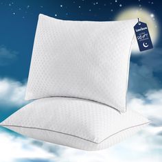 the pillows are on top of each other in the sky with stars and moon above them