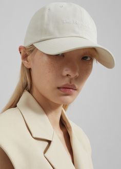 Color: Ivory Cotton twill  Classic baseball cap Embroidered logo Curved visor Adjustable back tab 100% Cotton Hand Wash  By The Frankie Shop. Imported Classic Baseball Cap With Curved Visor For Baseball Season, Classic Baseball Cap With Curved Visor, Classic Dad Hat With Embroidered Logo Visor, Classic Baseball Cap For Baseball Season With Visor, Classic Dad Hat With Embroidered Logo, Classic Visor Baseball Cap For Baseball Season, Classic Curved Brim Baseball Cap For Sports, Classic Baseball Cap For Baseball Season, Beige Six-panel Baseball Cap With Embroidered Logo