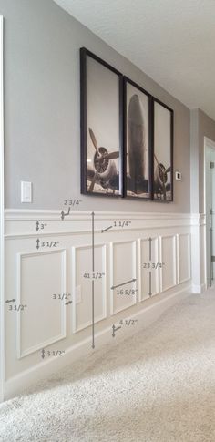 three framed pictures hang on the wall in an empty room, with measurements for each one