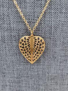 This beautiful brass gold filigree heart leaf necklace is perfect for any special occasion! The necklace features a beautiful gold chain with a brass gold heart leaf pendant. A leaf symbolizes growth and rebirth. Gift the earrings and necklace set to someone graduating high school or college, or show your support to someone going through significant changes in their life. Necklace measurements: Chain Length: 18 inches / 45.72cm Pendant: 1.10 inches / 2.8cm Valentine's Day Gold Necklace With Intricate Design, Gold Heart-shaped Brass Necklace, Gold Heart Pendant With Intricate Design, Gold Intricate Design Heart Pendant Jewelry, Gold Heart-shaped Brass Charm Necklace, Gold Filigree Heart Necklace, Gold Heart Charm Necklace In Brass, Gold Heart Filigree Necklace, Gold Heart-shaped Filigree Jewelry