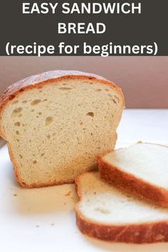 a loaf of bread sitting on top of a white counter next to slices of bread