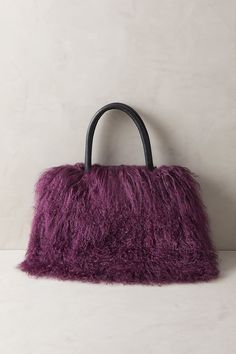 Our everyday handbag is exploding with soft, fluffy, Tibetan lamb that makes every day worth celebrating. And beyond the delightful texture of its beautiful fur, this novelty handbag carries comfortably by hand while organizing your essentials with ease. Luxury Faux Fur Bags For Everyday Use, Luxury Faux Fur Bag For Everyday Use, Winter Sheepskin Rectangular Bag, Winter Rectangular Sheepskin Bags, Chic Fluffy Shoulder Bag For Everyday, Fluffy Tote Shoulder Bag, Fluffy Tote Bag For Daily Use, Fluffy Rectangular Shoulder Bag For Shopping, Fluffy Shoulder Bag For Everyday Use