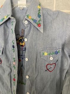 Awesome 1970’s embroidered kids long sleeve shirt. Typical wear but in overall great shapeArmpit to armpit: 15.5”Shoulder to hem: 16” Embroidered Cotton Collared Blouse, Bohemian Long Sleeve Tops With Machine Embroidery, Embroidered Slim Fit Cotton Shirt, Fitted Cotton Shirt With Embroidery, Long Sleeve Cotton Tops With Machine Embroidery, Fitted Embroidered Cotton Shirt, Vintage Blue Embroidered Blouse, Casual Cotton Blouse With Machine Embroidery, Fitted Long Sleeve Shirt With Embroidery