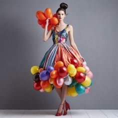 a woman in a dress made out of balloons