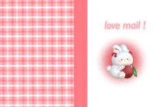 a pink and white checkered table cloth with a bunny holding a strawberry