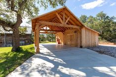 a large wooden building sitting next to a tree