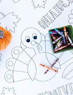 the turkey is next to some crayons and pumpkins