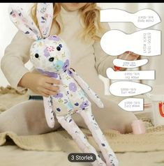 a girl is holding a stuffed animal in front of her face and the caption says, 3 stork