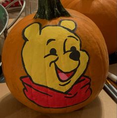 a winnie the pooh pumpkin is painted on