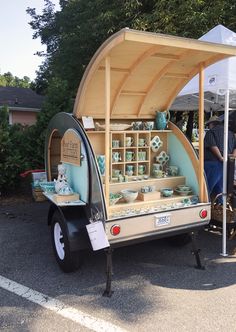 an old fashioned trailer has been converted into a tea cart