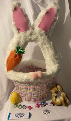 an easter basket with bunny ears and carrots