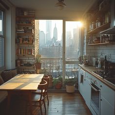 a kitchen with a table and chairs in front of a large window overlooking the city