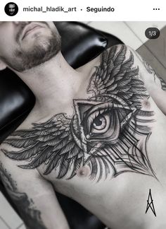 a man with an eye tattoo on his chest