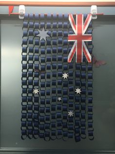 an australian flag is hanging on the wall