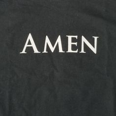 an amen t - shirt with the word amen printed in white on it