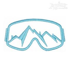 a pair of ski goggles with mountains in the background