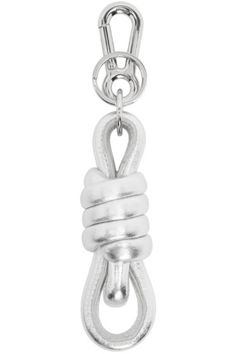 a silver chain with a knot hanging from it's end on a white background