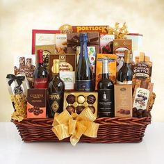 a wine basket filled with lots of different types of wines and chocolates in it